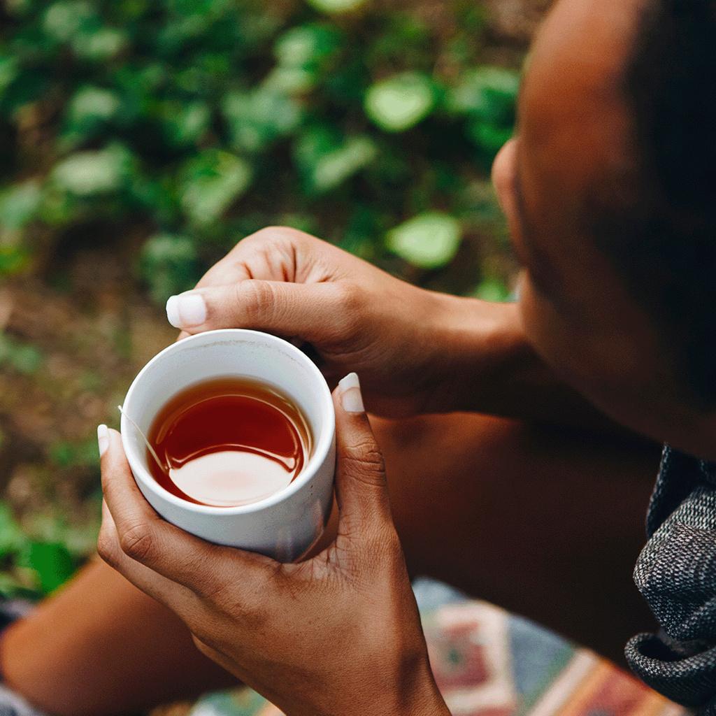 Cup of tea being held in hands