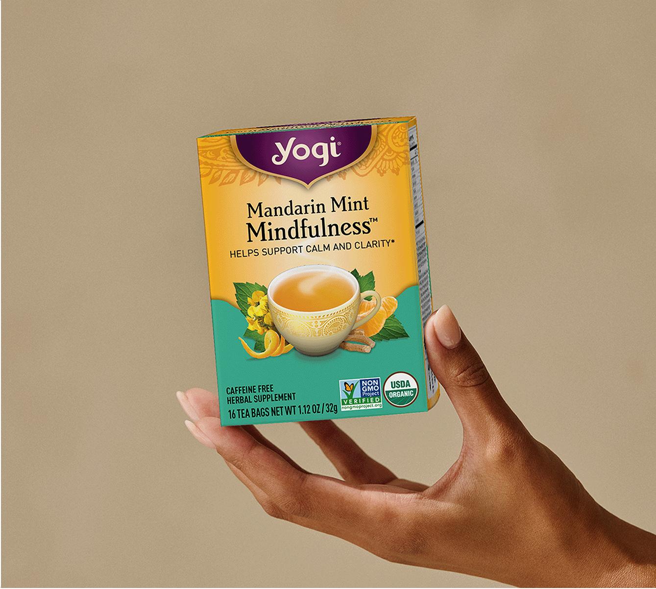 Hand holding tea box