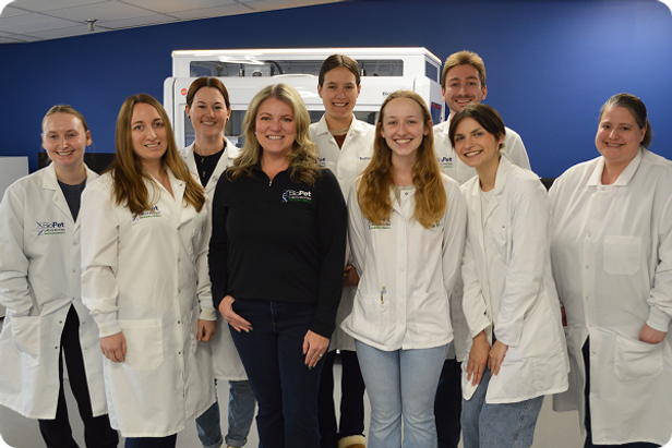 A group of smiling scientists and analysts at the BioPet lab