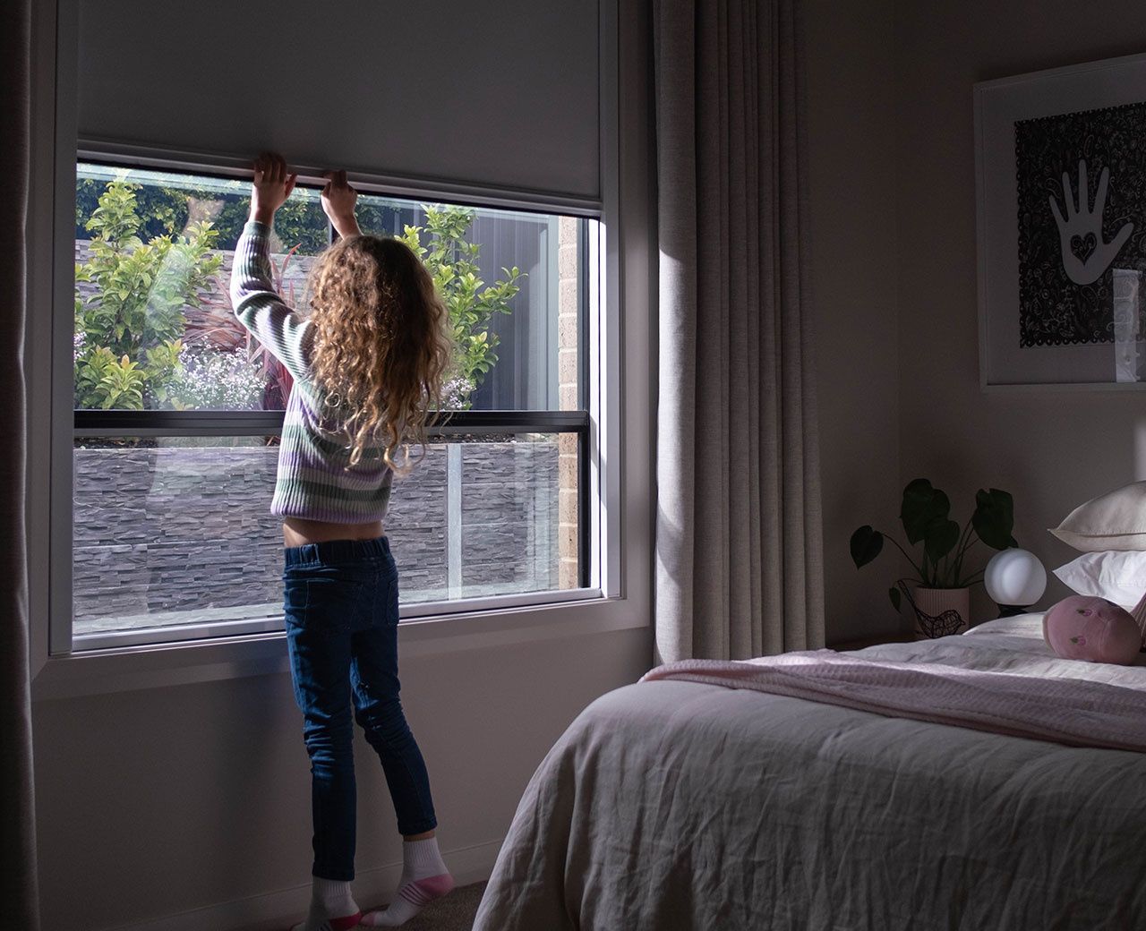 Children's room with UBlockout sealed track shades in top-down position allowing natural light while maintaining privacy