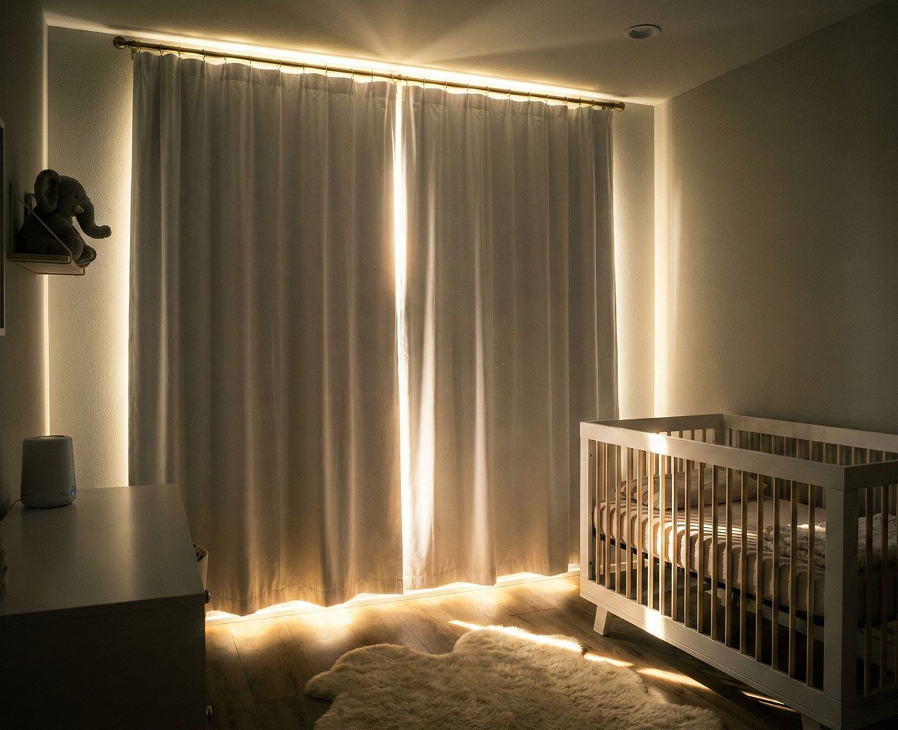 Nursery with standard curtains allowing bright light gaps around edges near baby crib