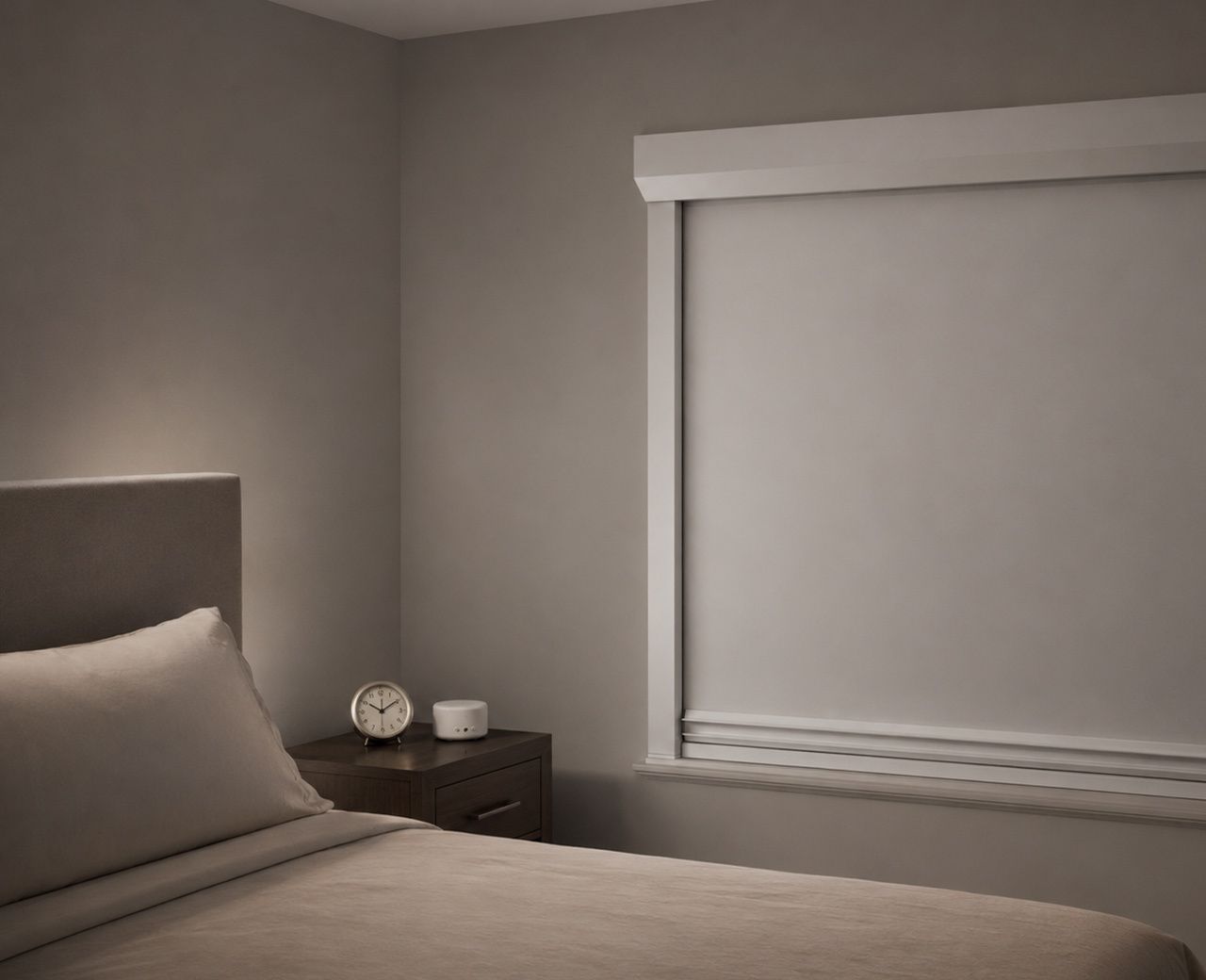 Calm, screen free bedroom with an analog alarm clock, sound machine and closed window coverings