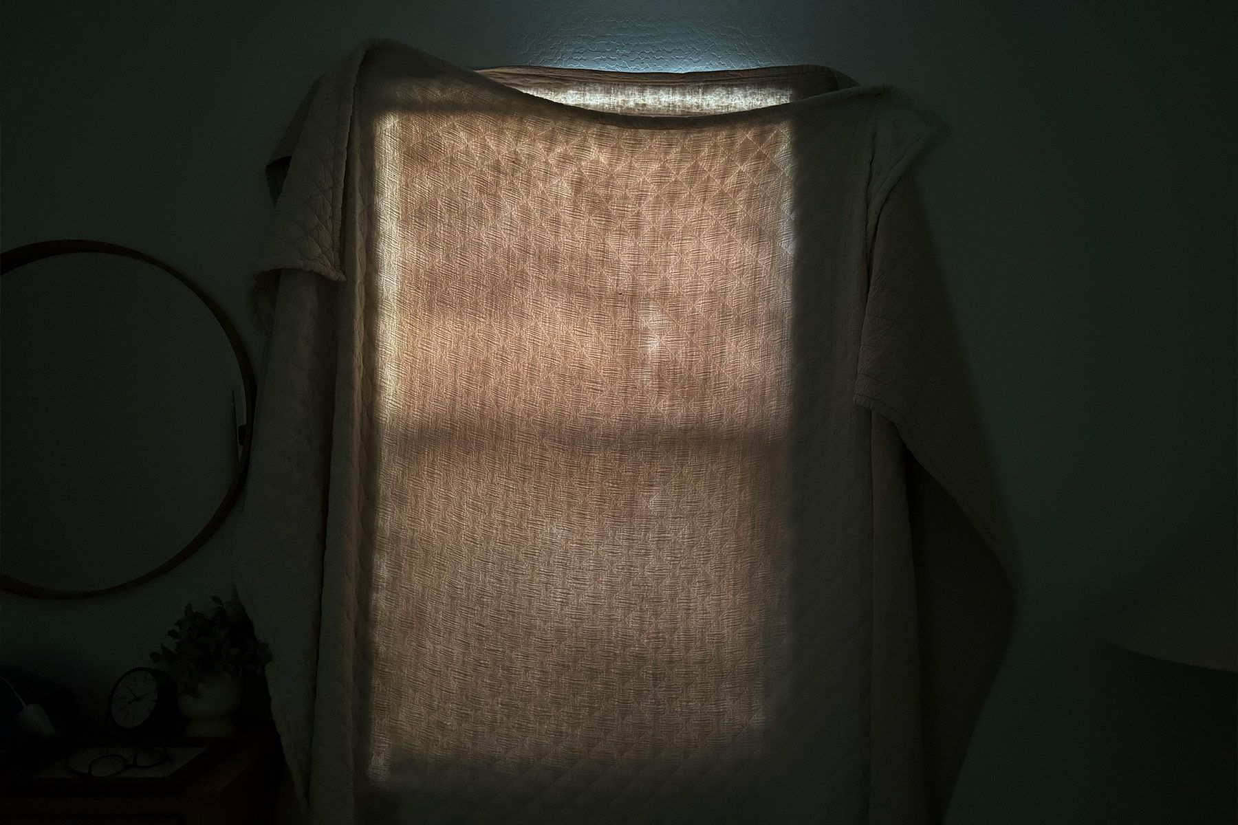 blackout curtains on rod leaking light on each side and through fabric 