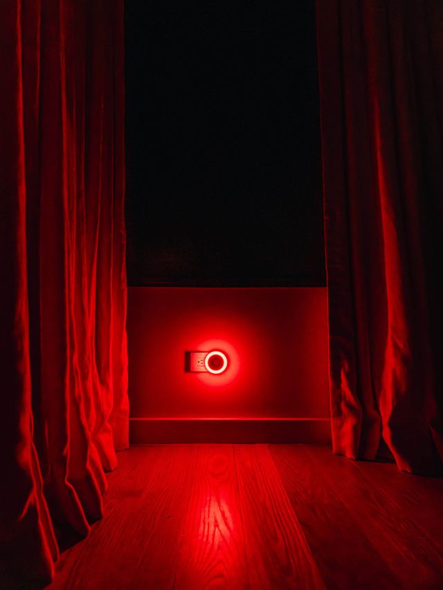 UBlockout motorized blackout shade achieving 100% darkness with red ambient night light