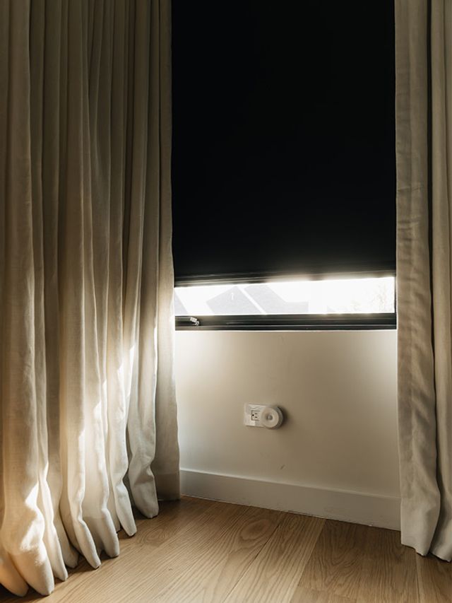 UBlockout blackout shades installed with curtains showing sealed light blocking system