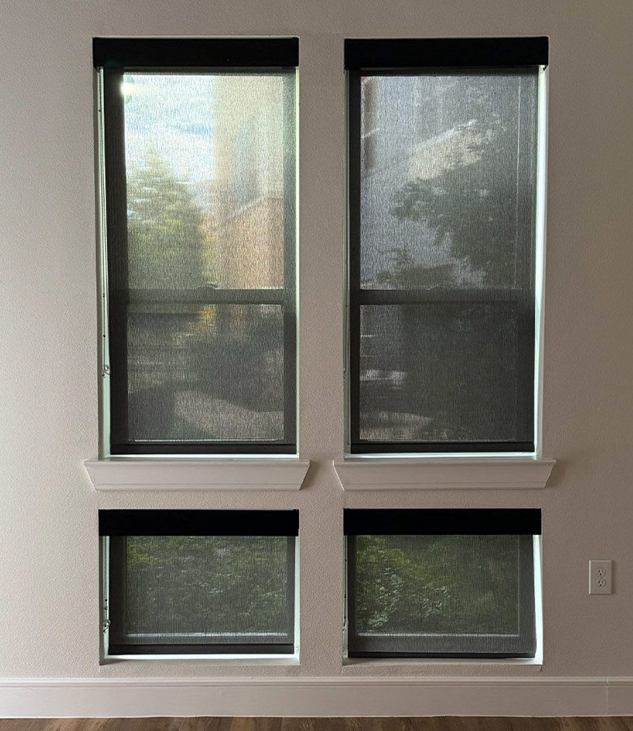 Four windows showing light leakage through standard blackout shades compared to true blackout performance