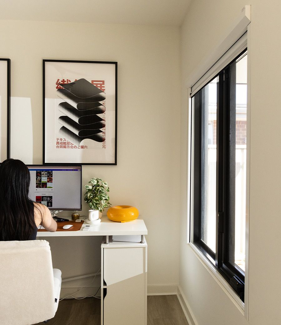 Home office workspace with UBlockout shades providing glare-free lighting for productivity