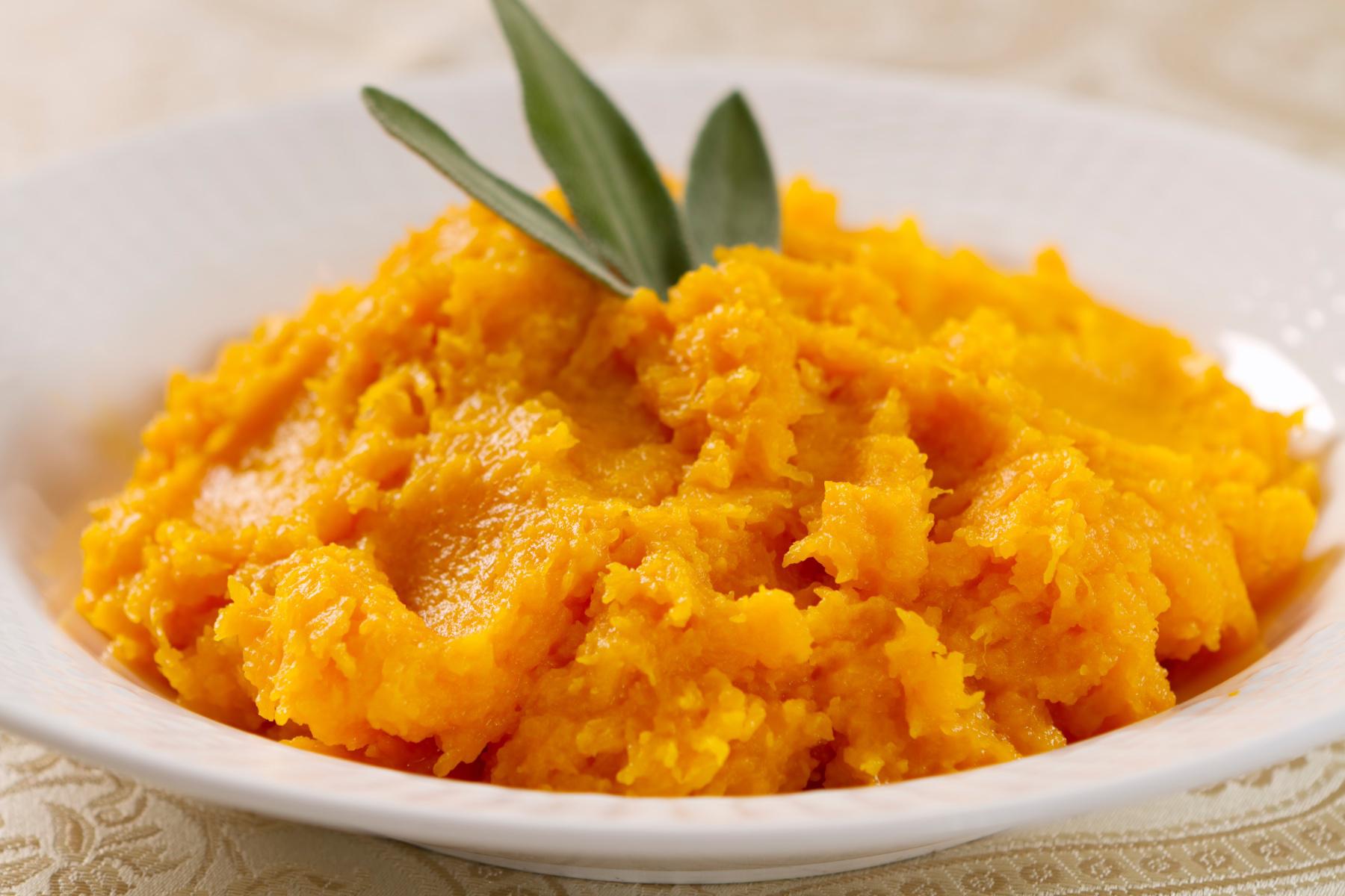 Close-up of mashed butternut squash in bowl.