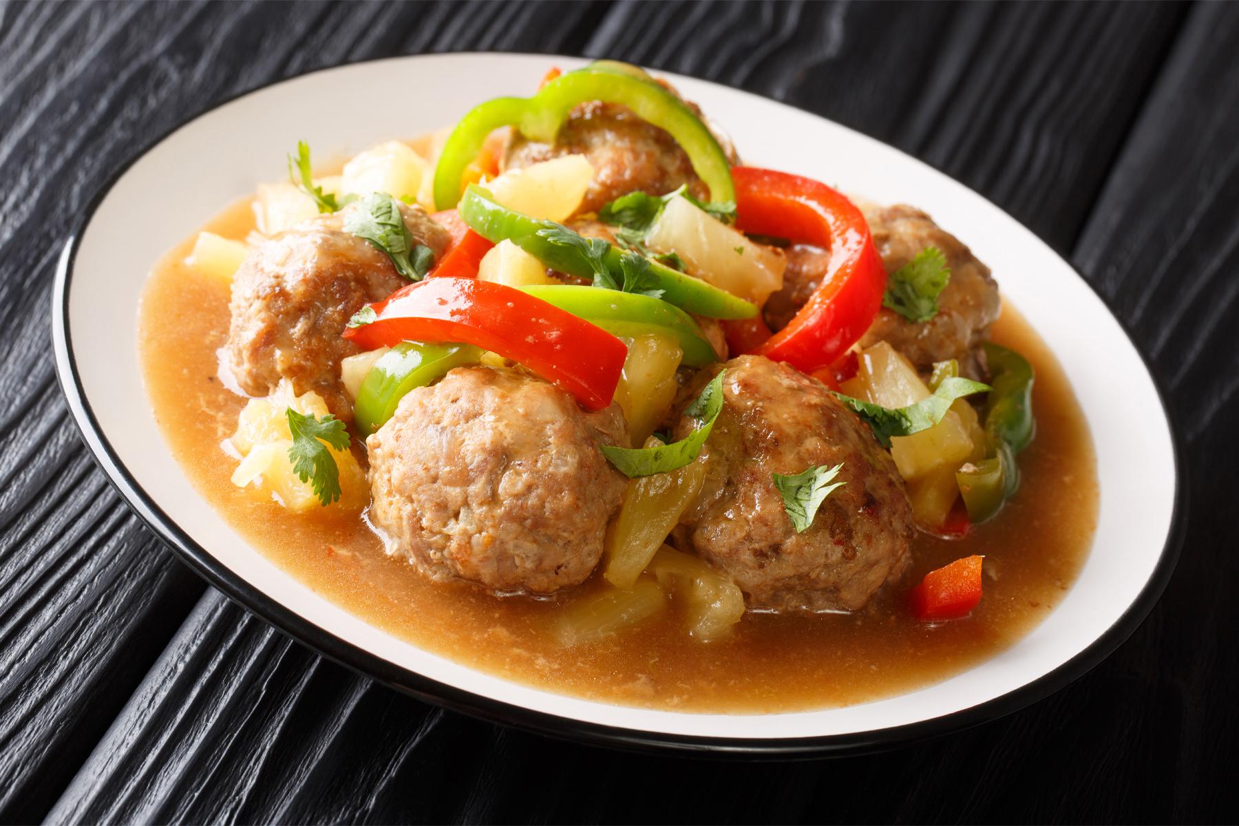 Canyon Ranch Chicken Meatballs with Soy Glaze & Pineapple on a plate.