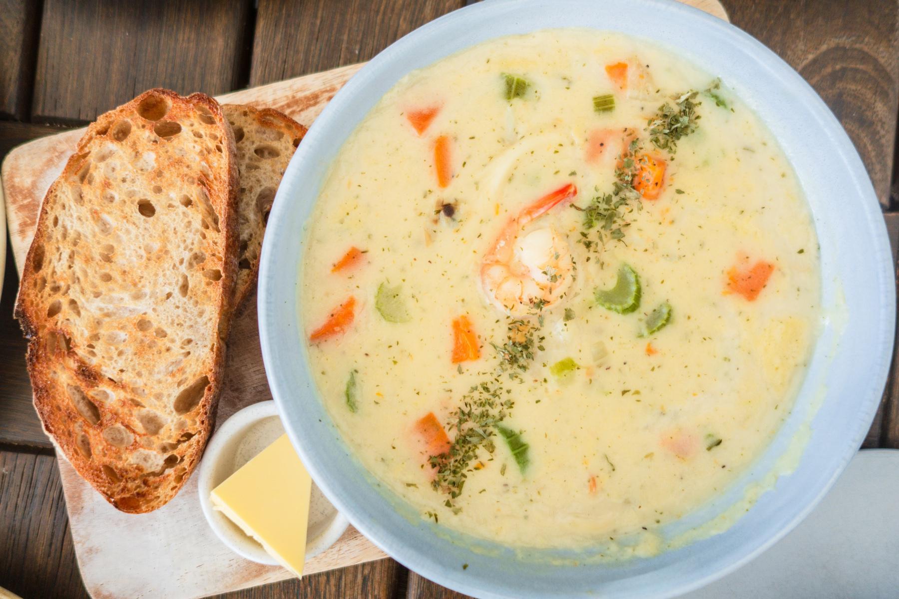 Overhead view of shellfish chowder in bowl.