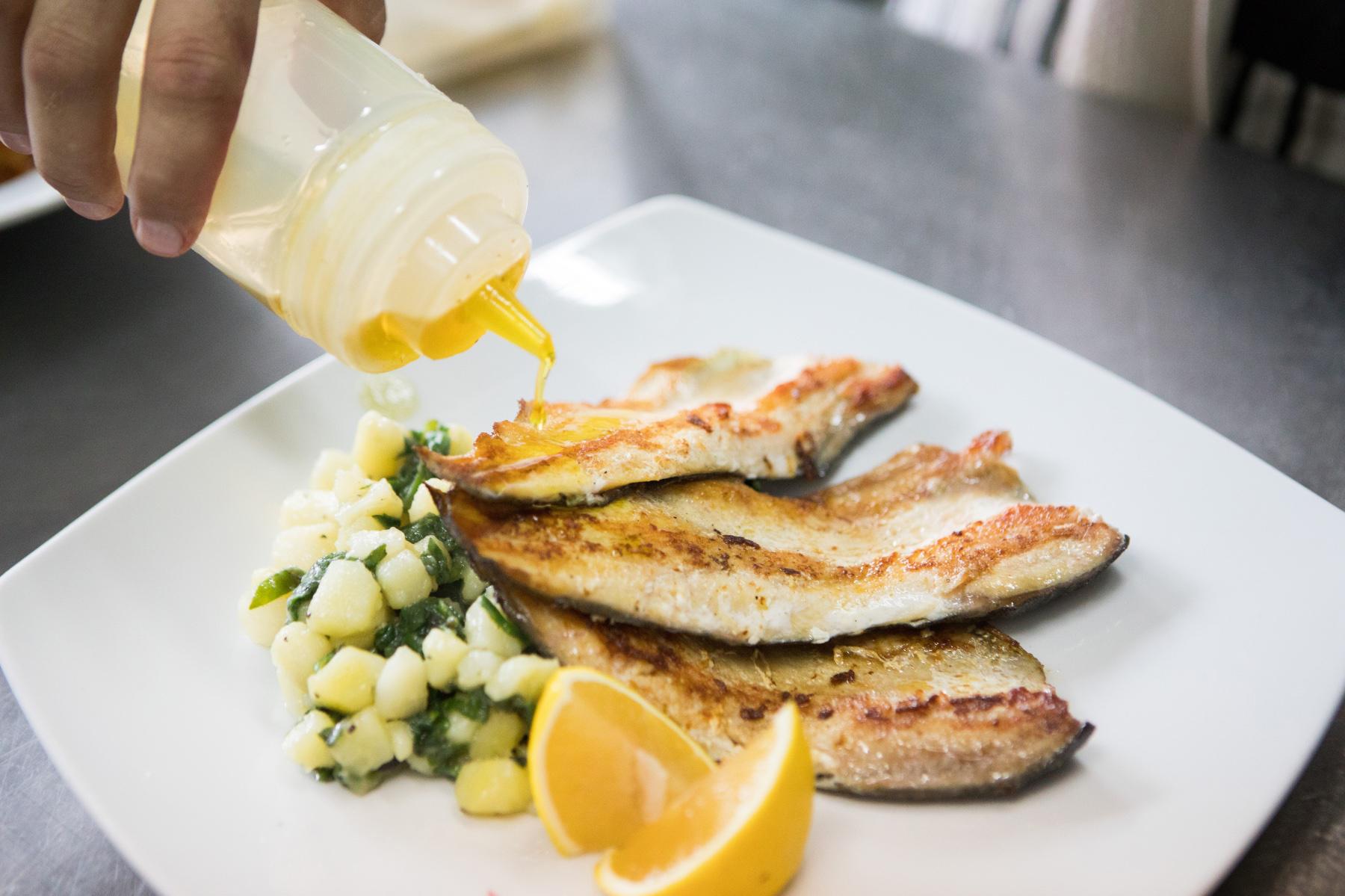Marinated trout on white plate.