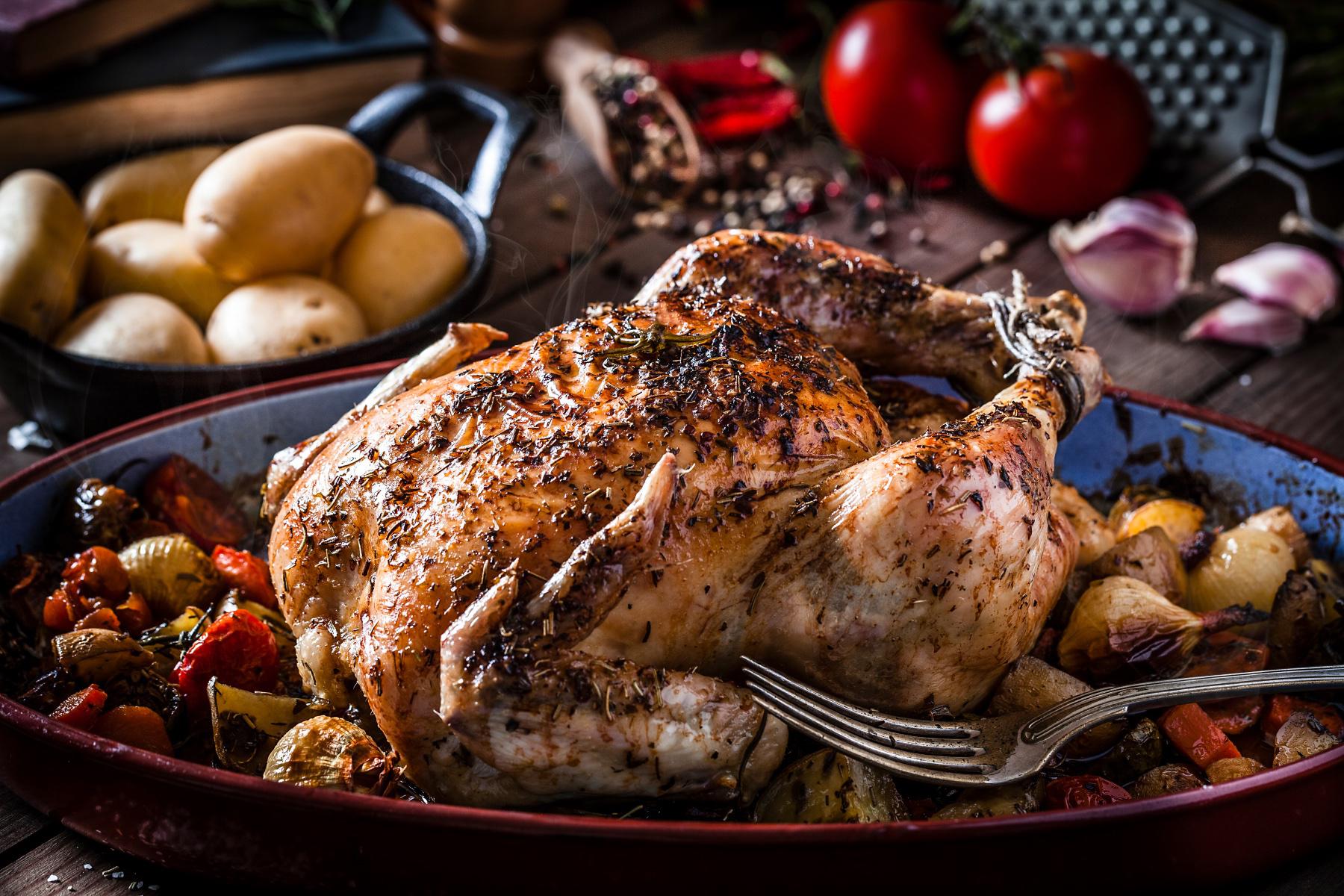 A roasted chicken with vegetables.