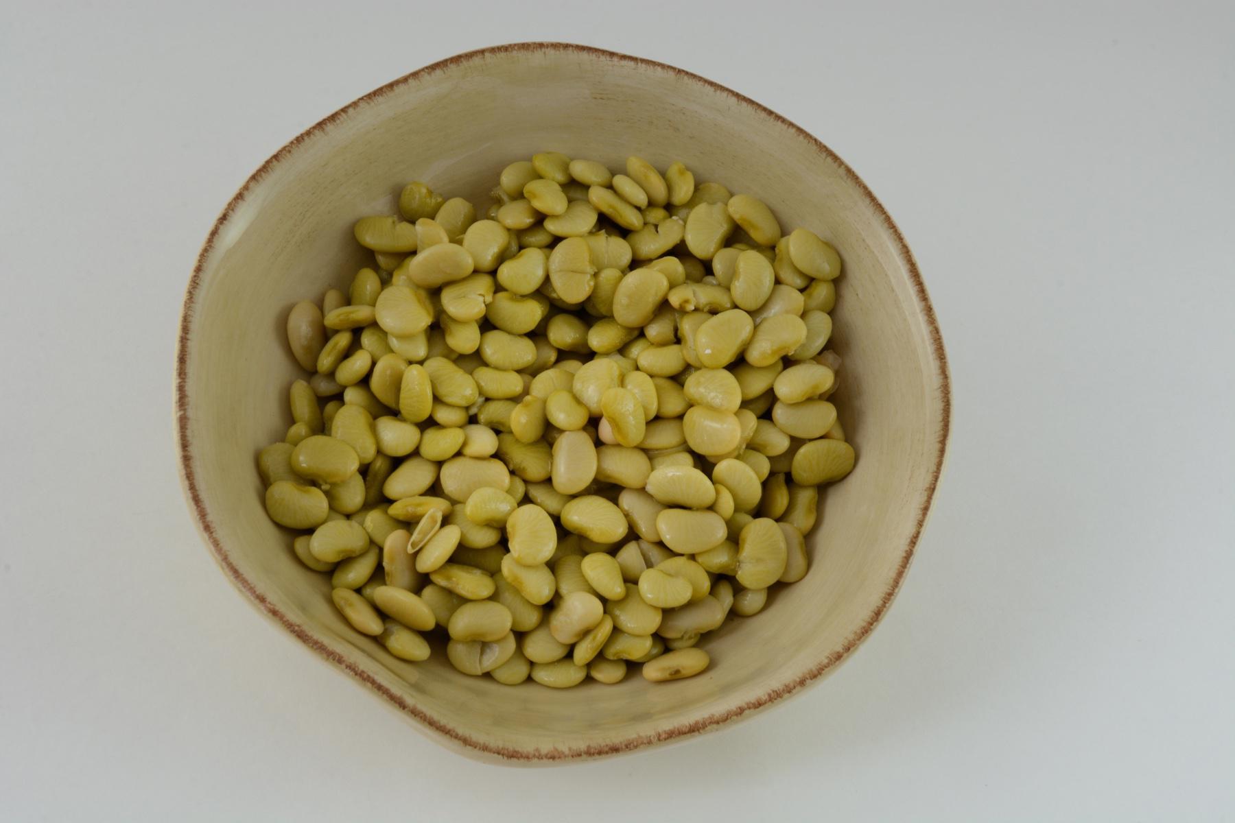 Overhead view of a bowl of lima beans.