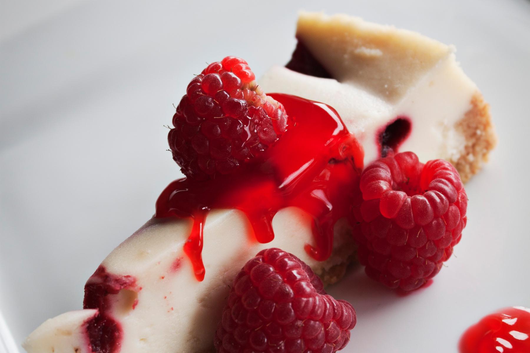 A slice of raspberry cheesecake.