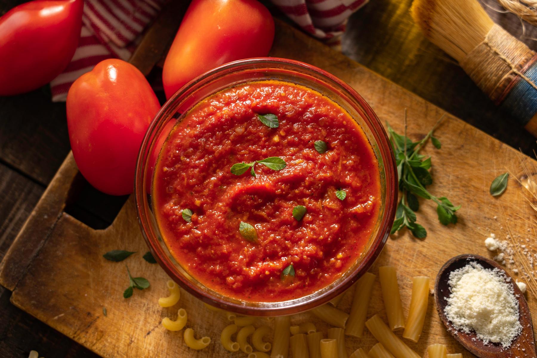 Overhead view of a bowl of puttanesca sauce.