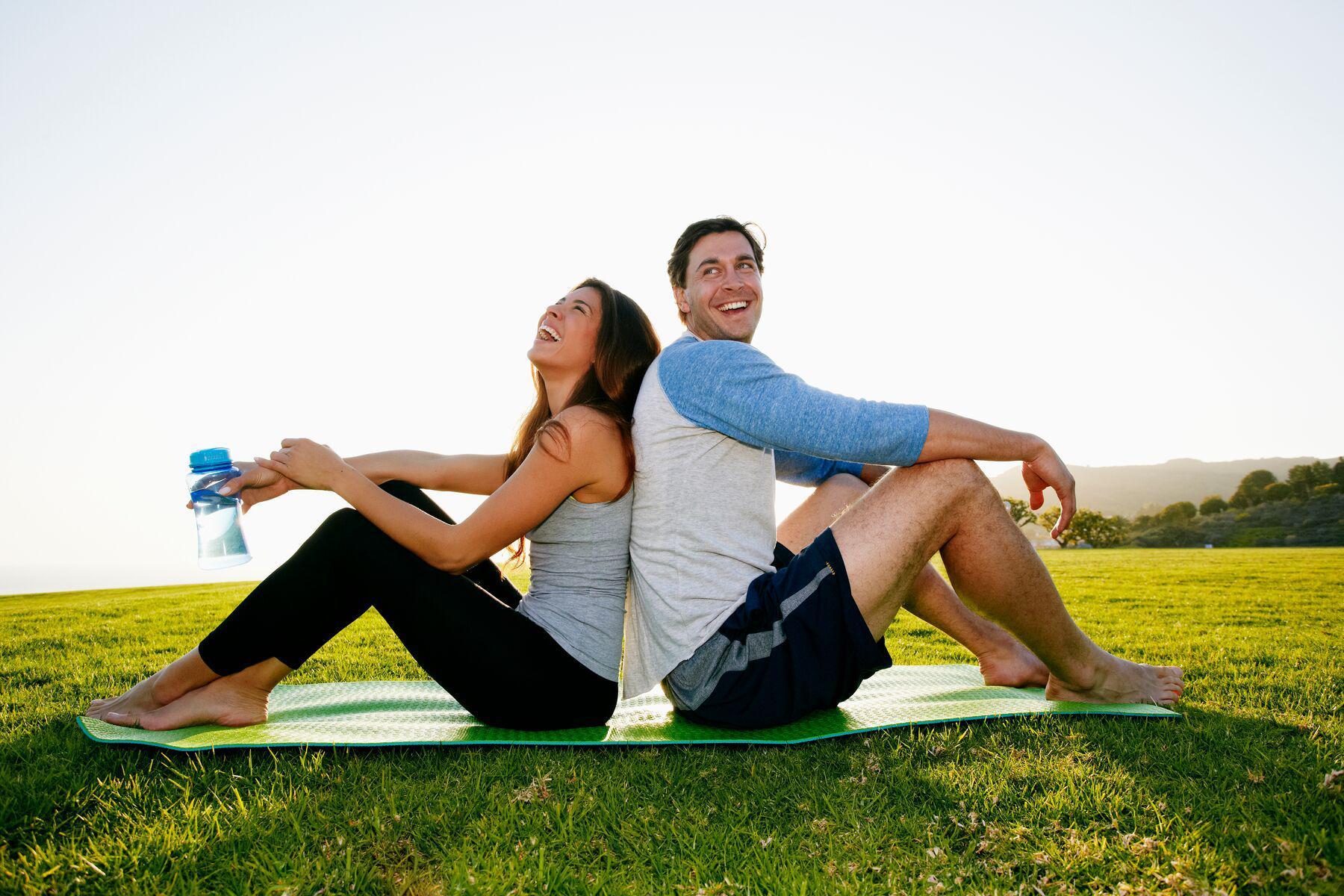 A couple sitting together on the Great Lawn at Canyon Ranch Lenox Fitness + Spa Resort