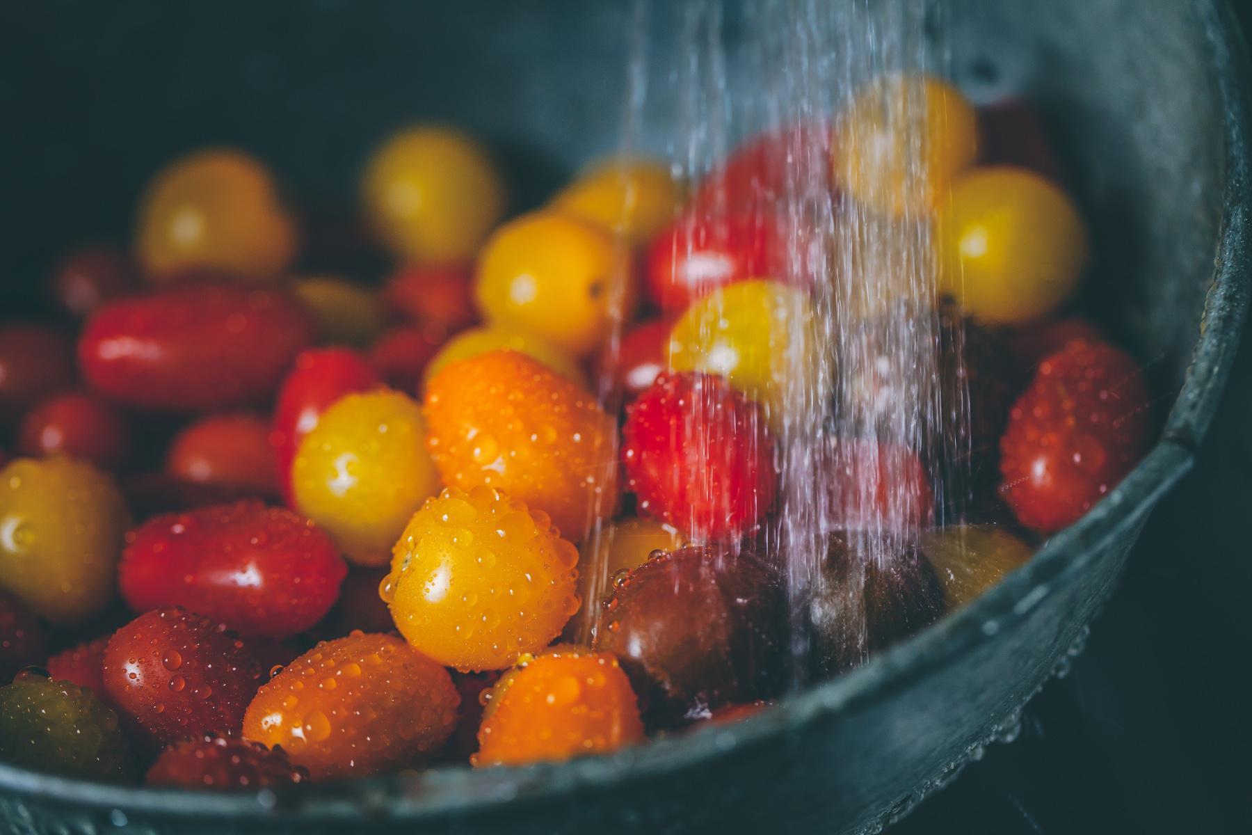 close-up of water on a bowl of cherry tomatoes
