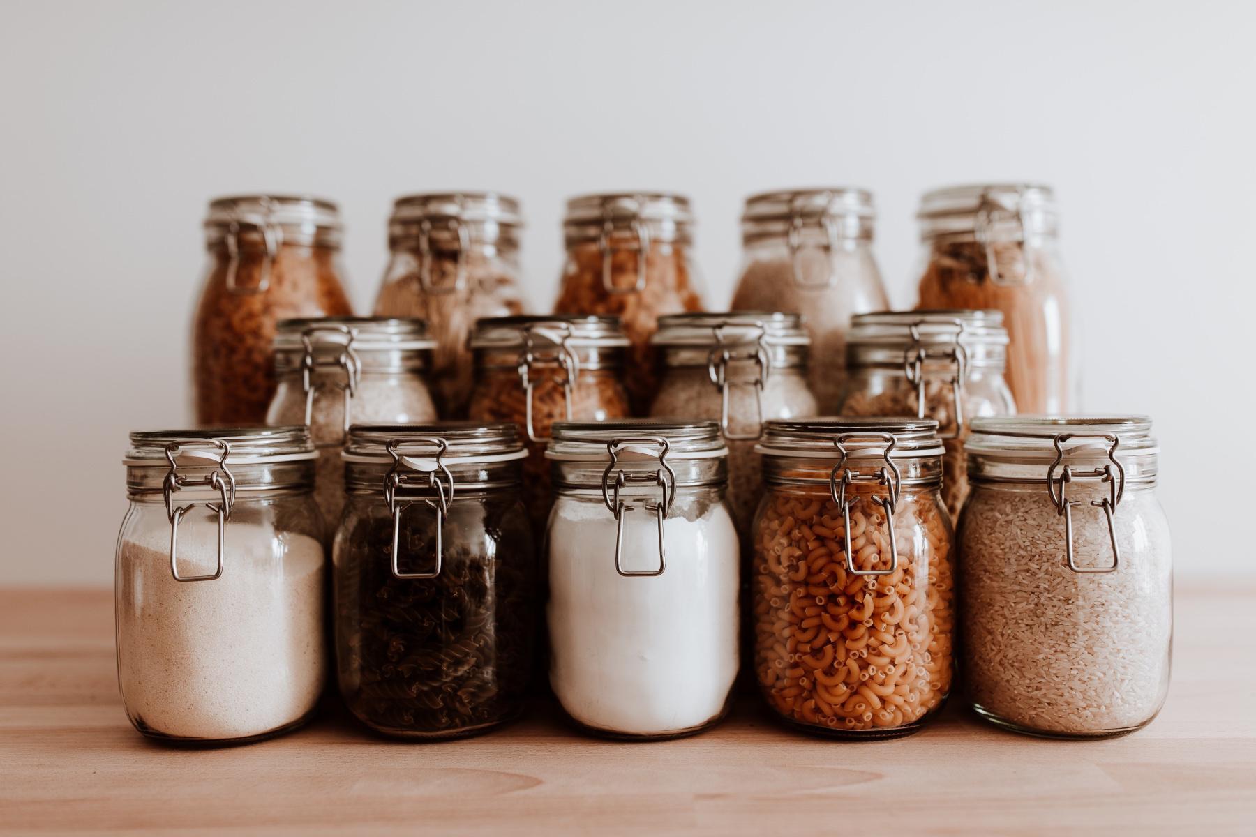 close-up of jars with different grains and pastas