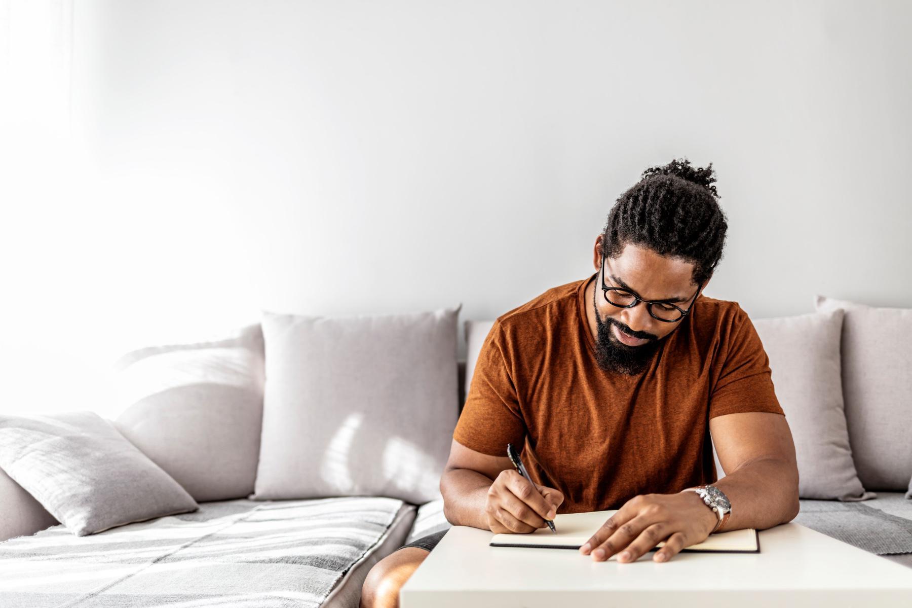 A man writing in his journal.