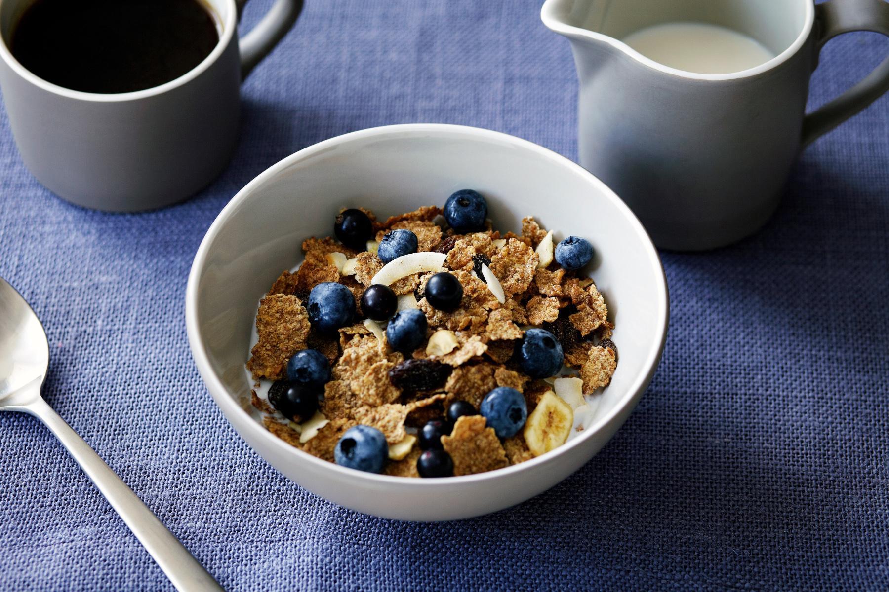 close-up of a bowl of healthy cereal with blueberries on top
