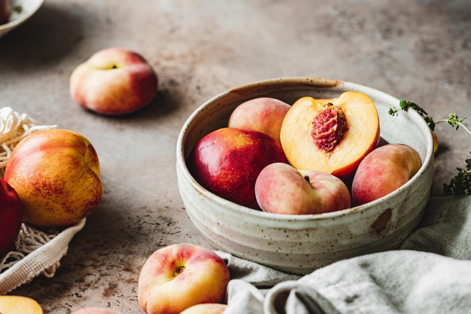 close-up of a bowl of fresh peaches