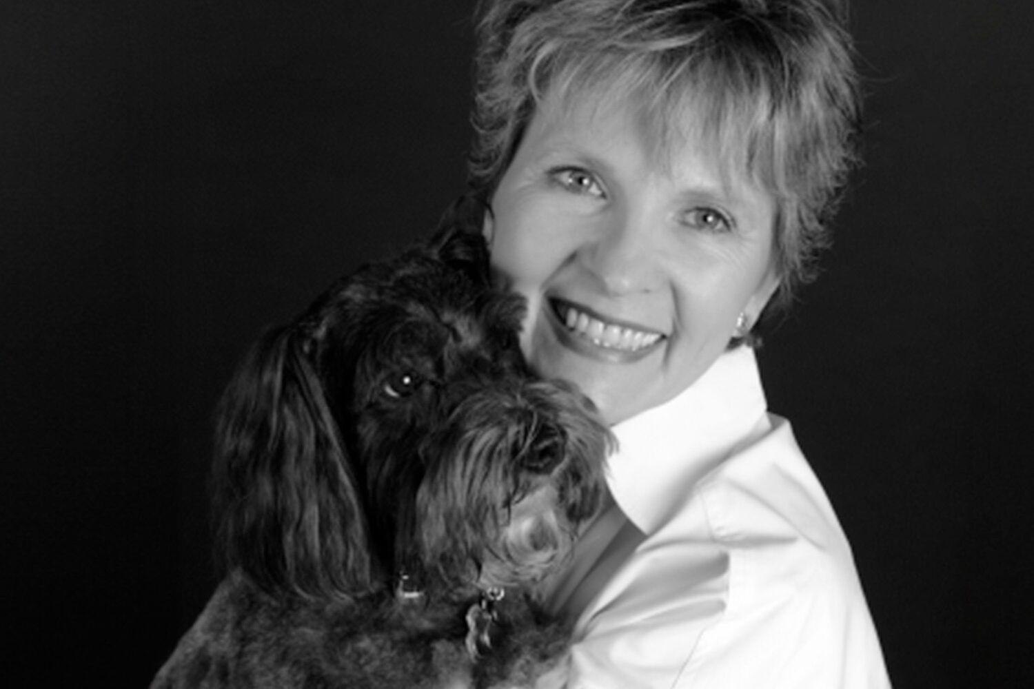 Headshot of Diane Roadcap and her dog