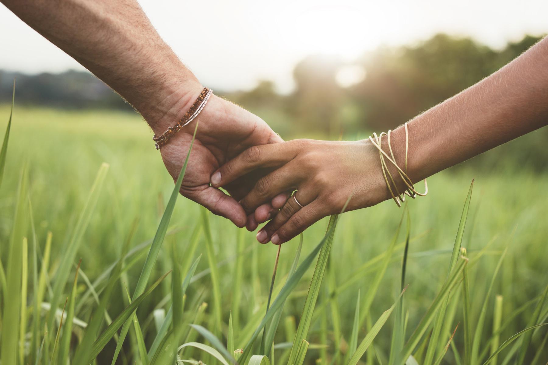 A couple holding hands.