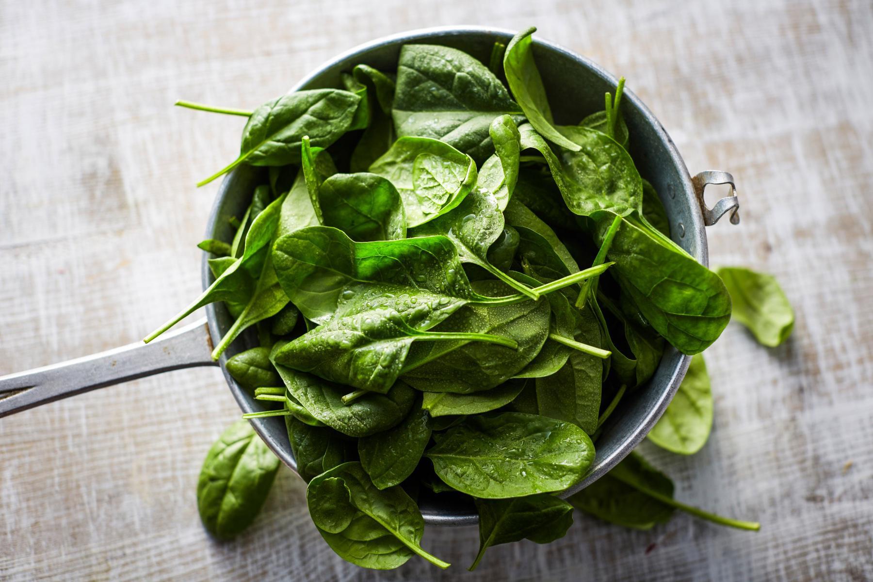Overhead view of a bowl of spinach.