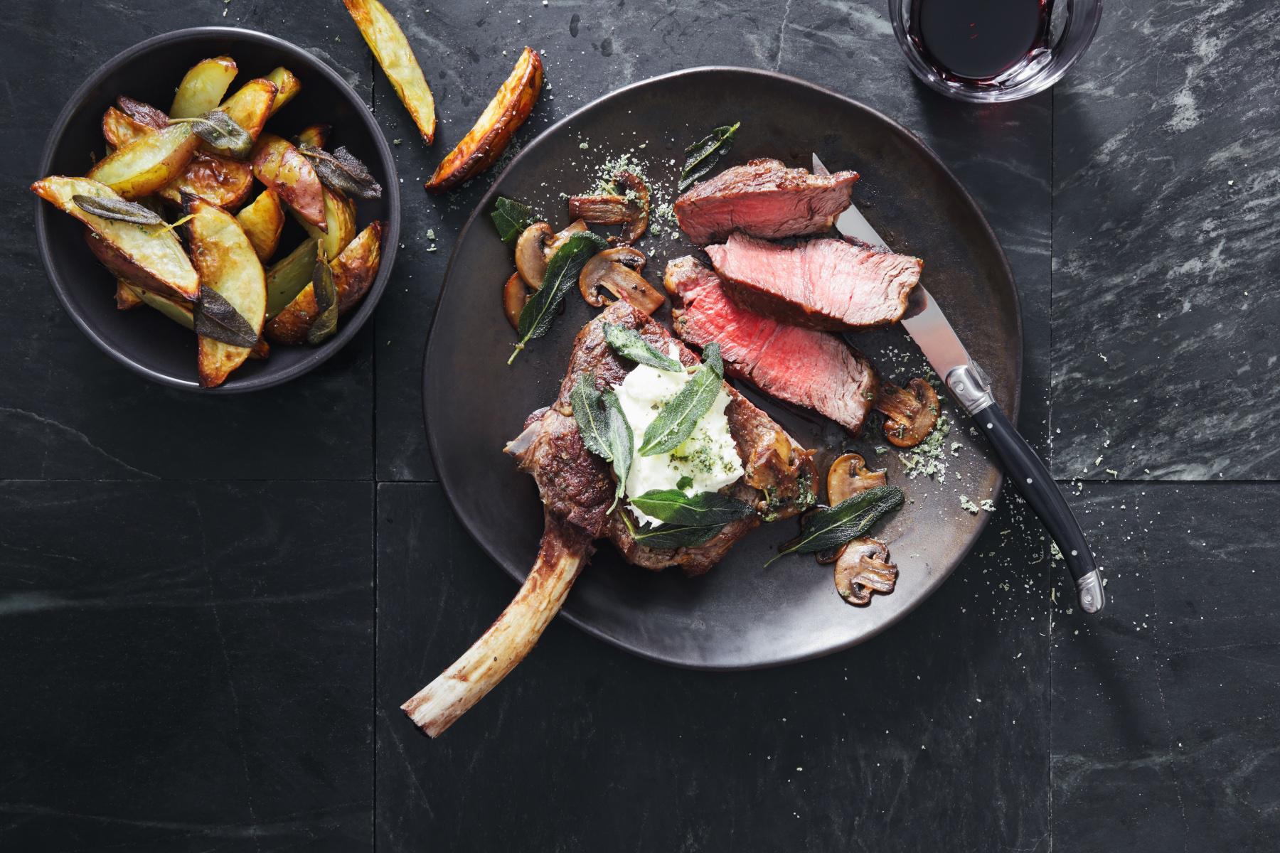 overhead view of a cooked steak on a plate