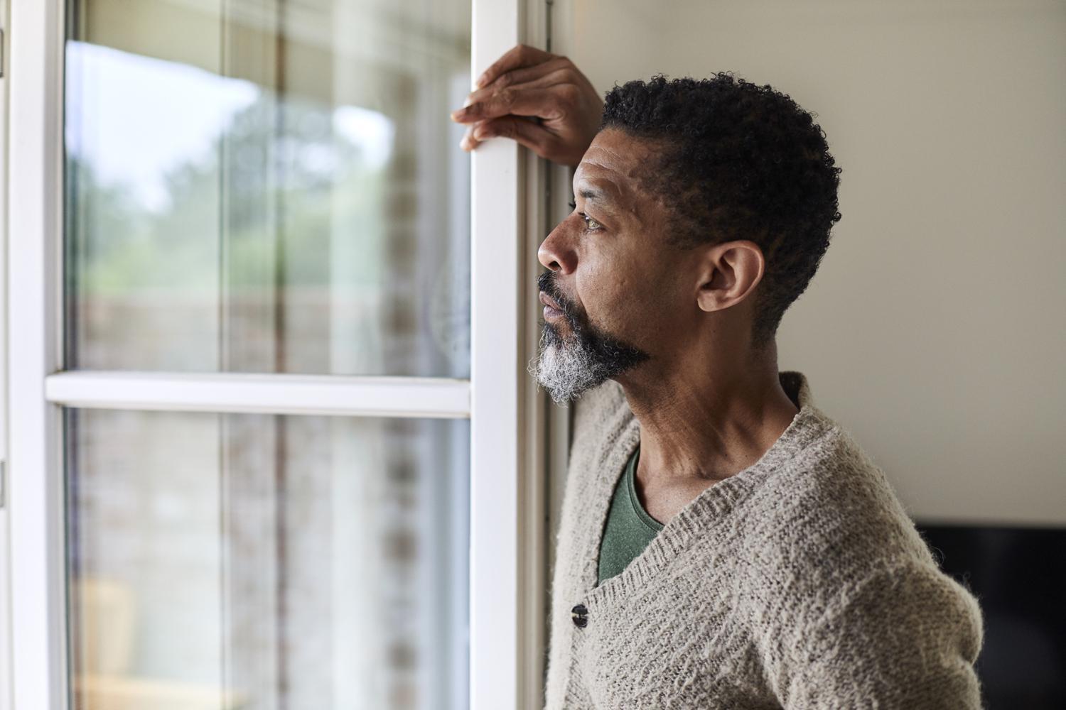a man looking out a window