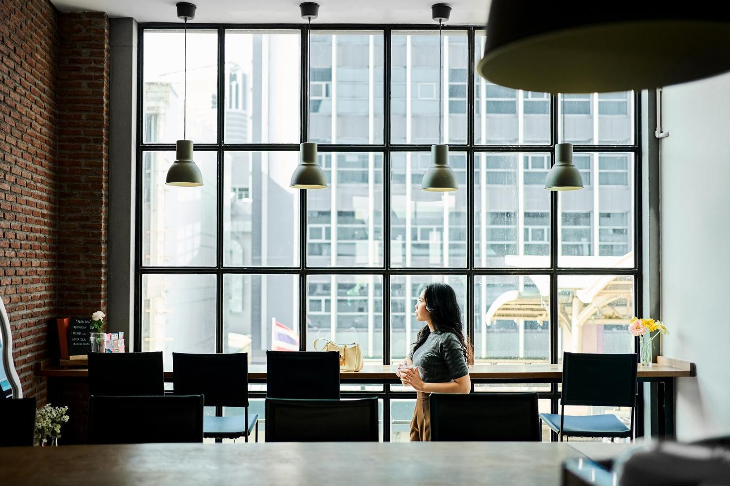 a woman looking out a window