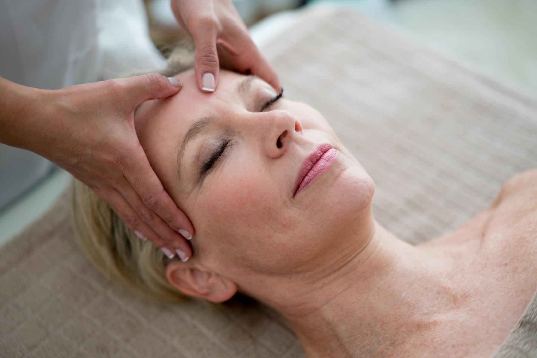 Woman receiving a head massage.