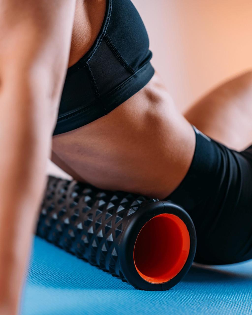 Woman foam rolling at Canyon Ranch Vitality Studio