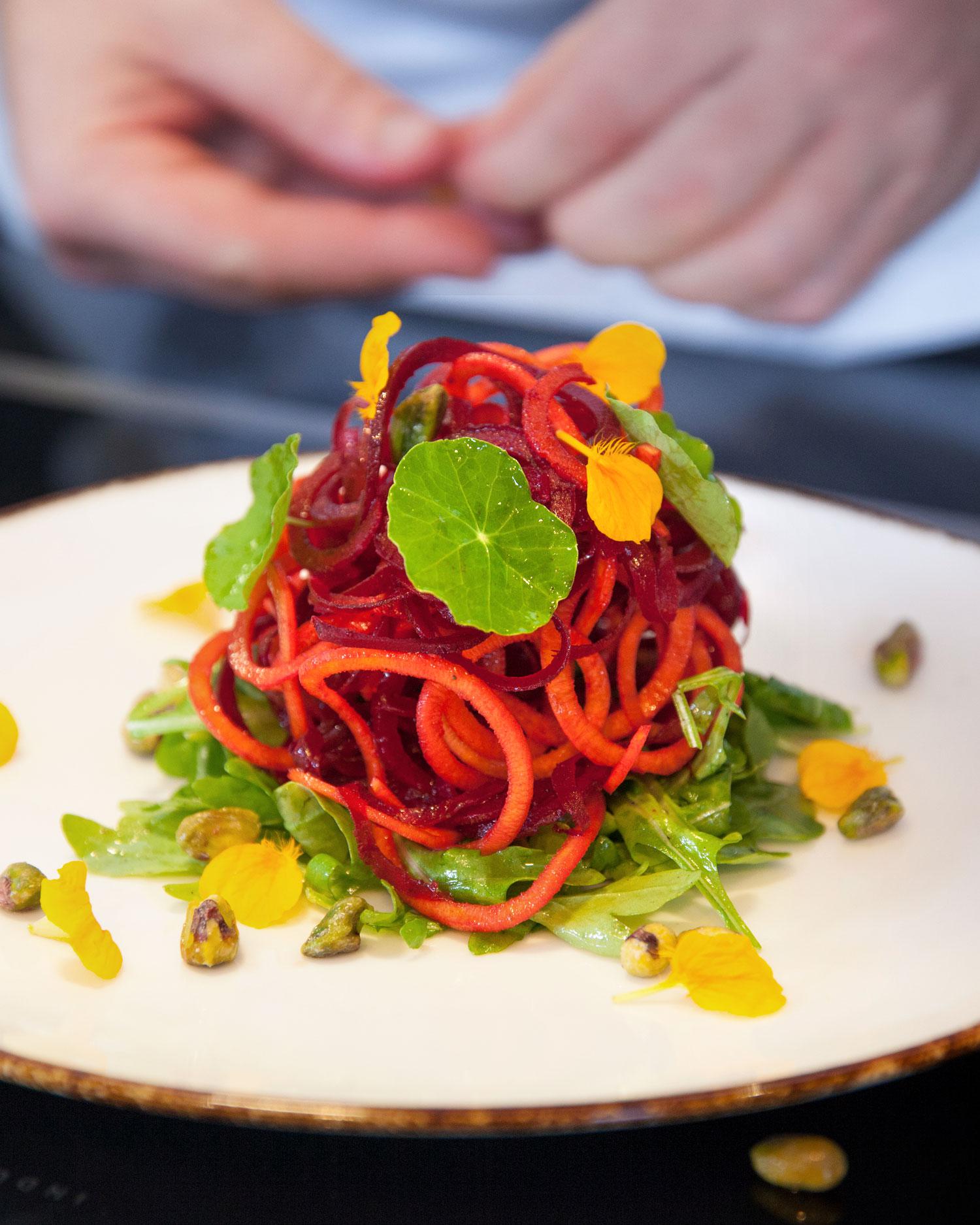 A close-up of a beet and carrot salad.