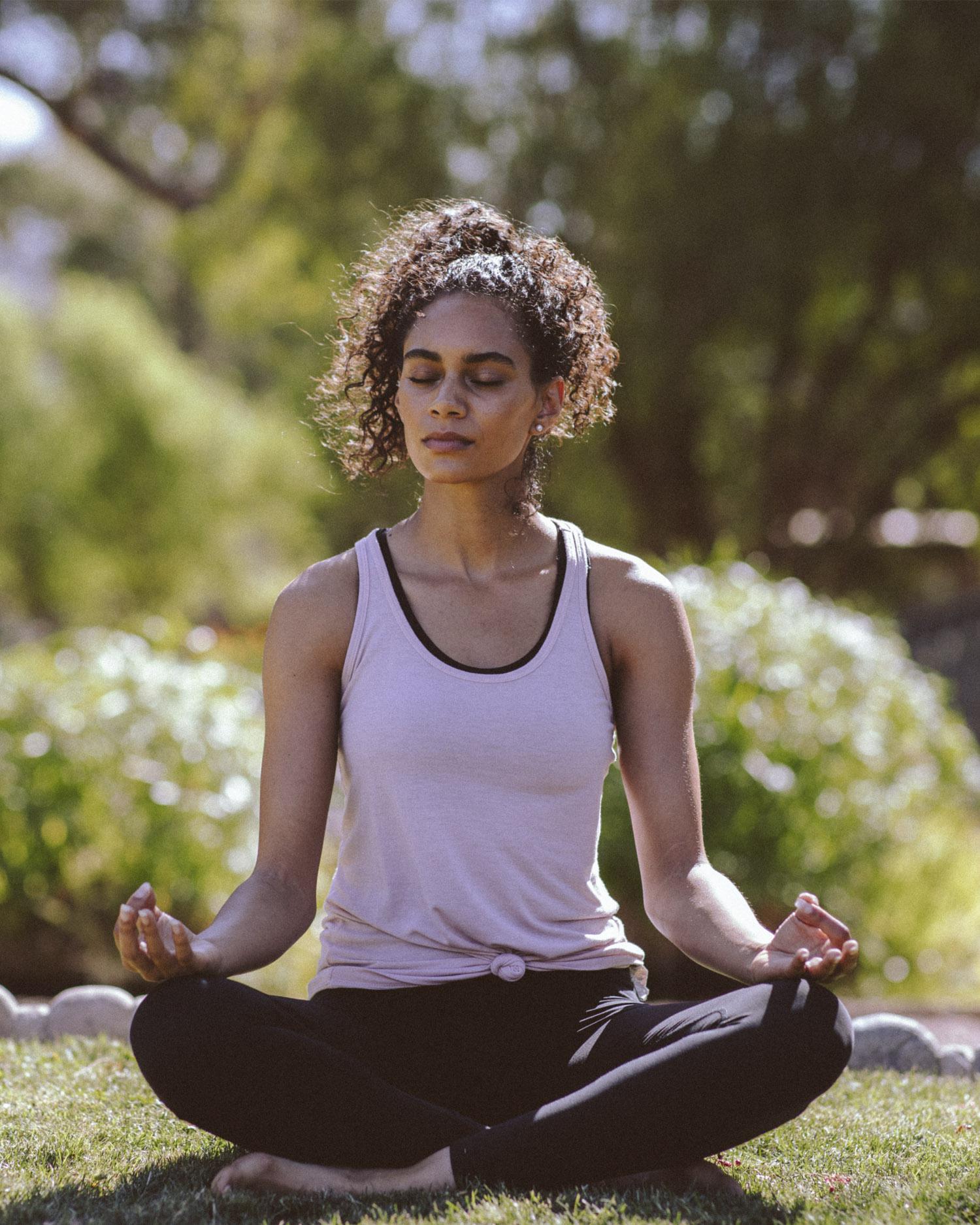 Woman practicing meditation in Casitas Park