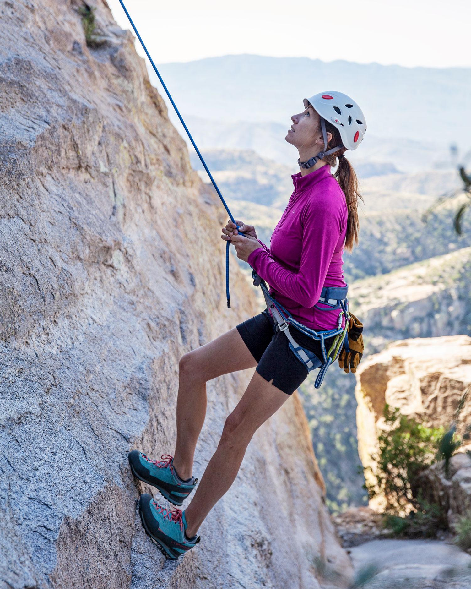 Woman rock climbing.