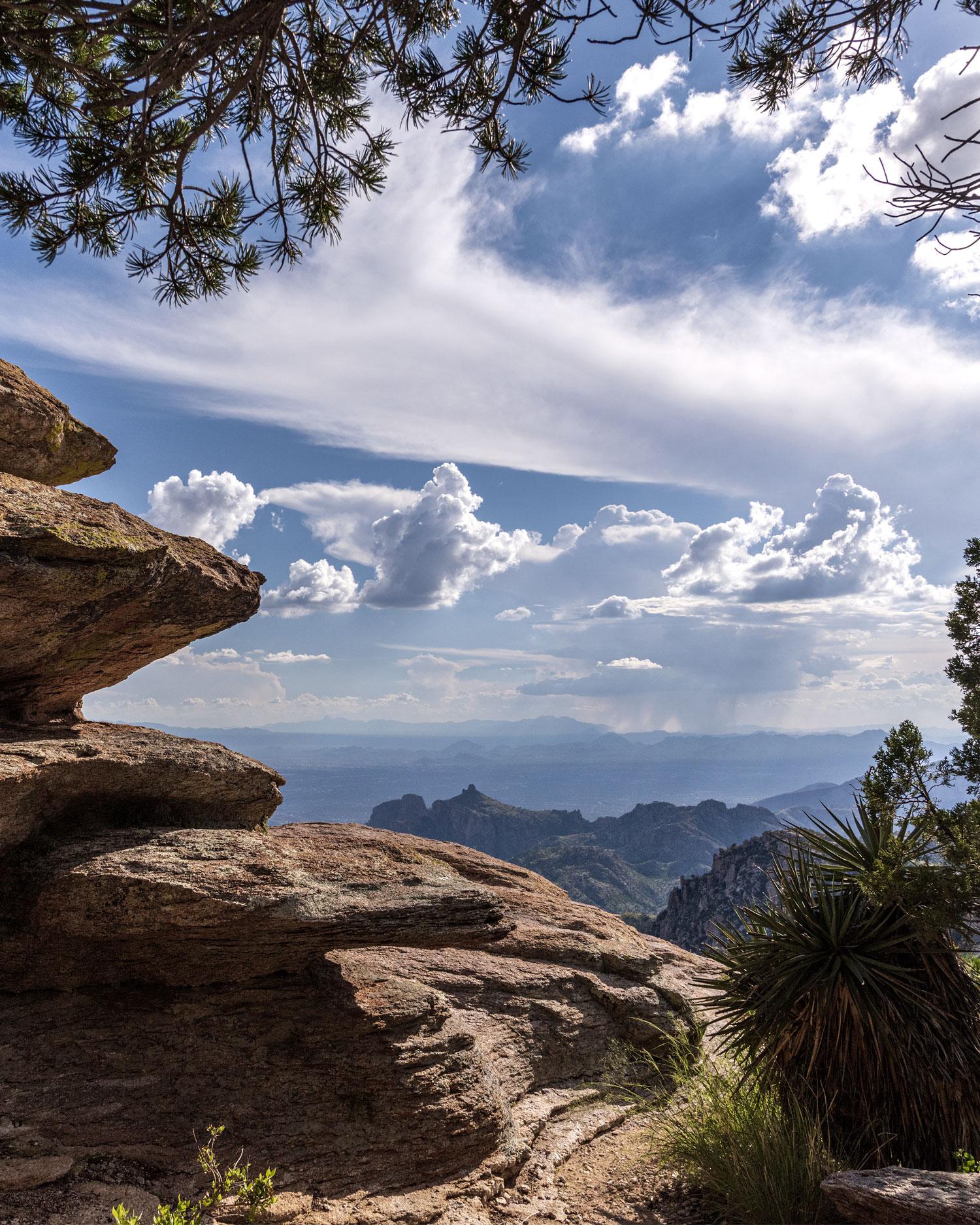 Couple sitting on mountain.