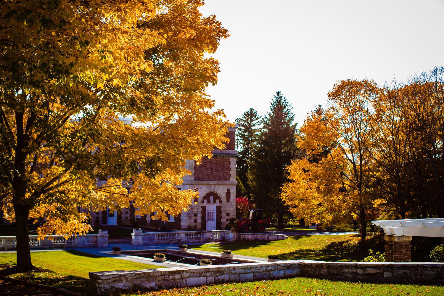 The Bellefontaine Mansion amid beautiful fall foliage.