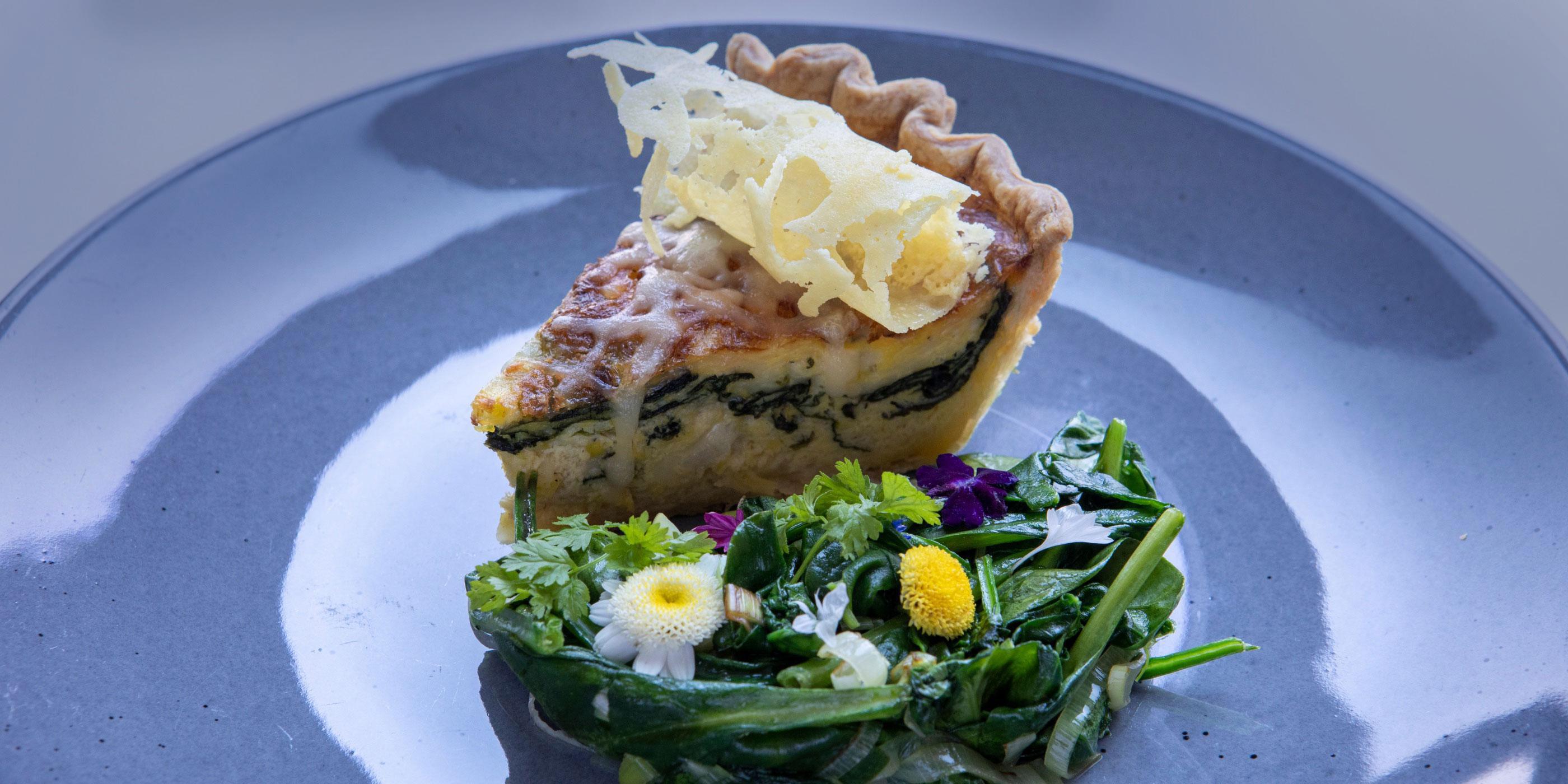 A close-up of a quiche entree