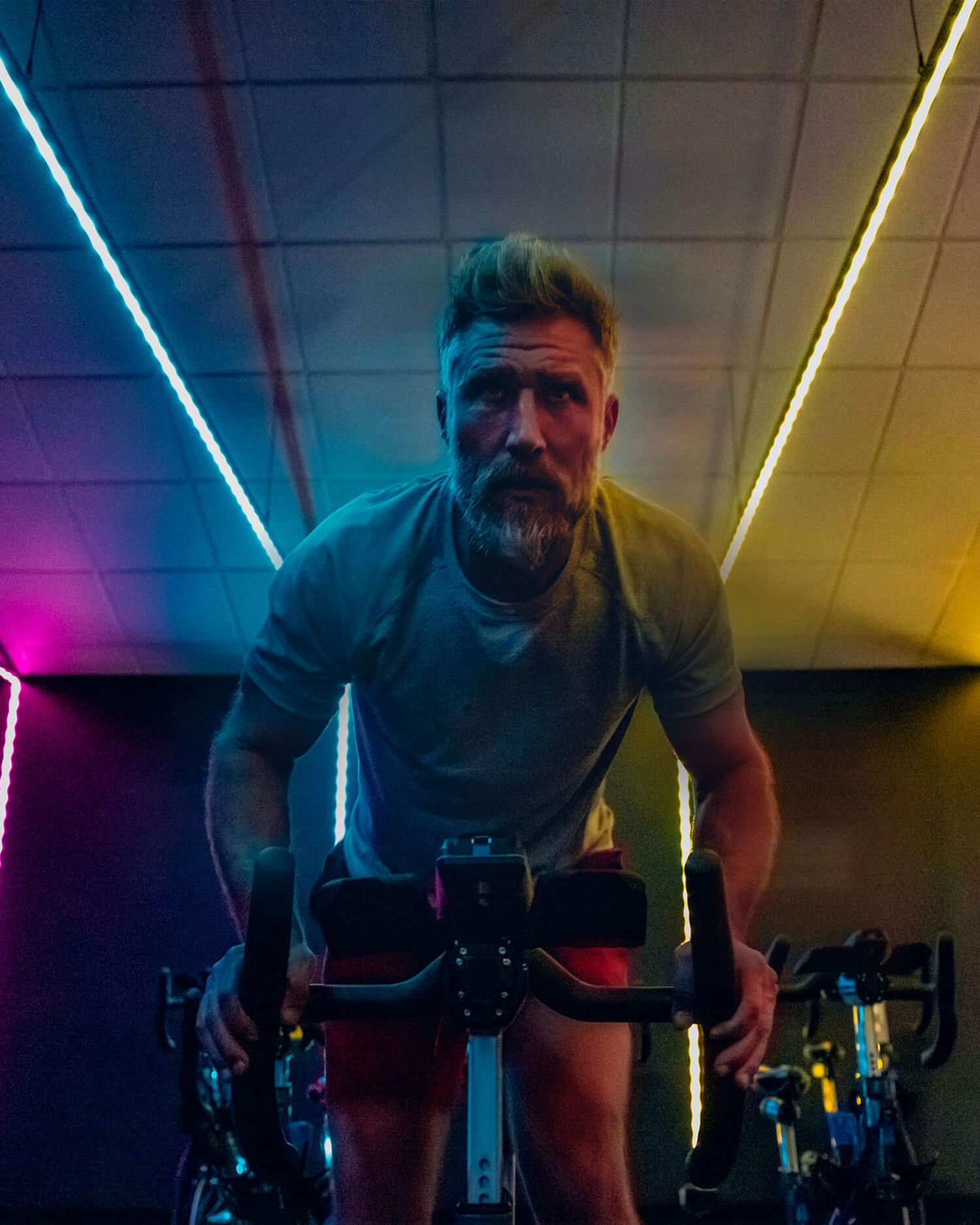 A man on a bike in a spin studio
