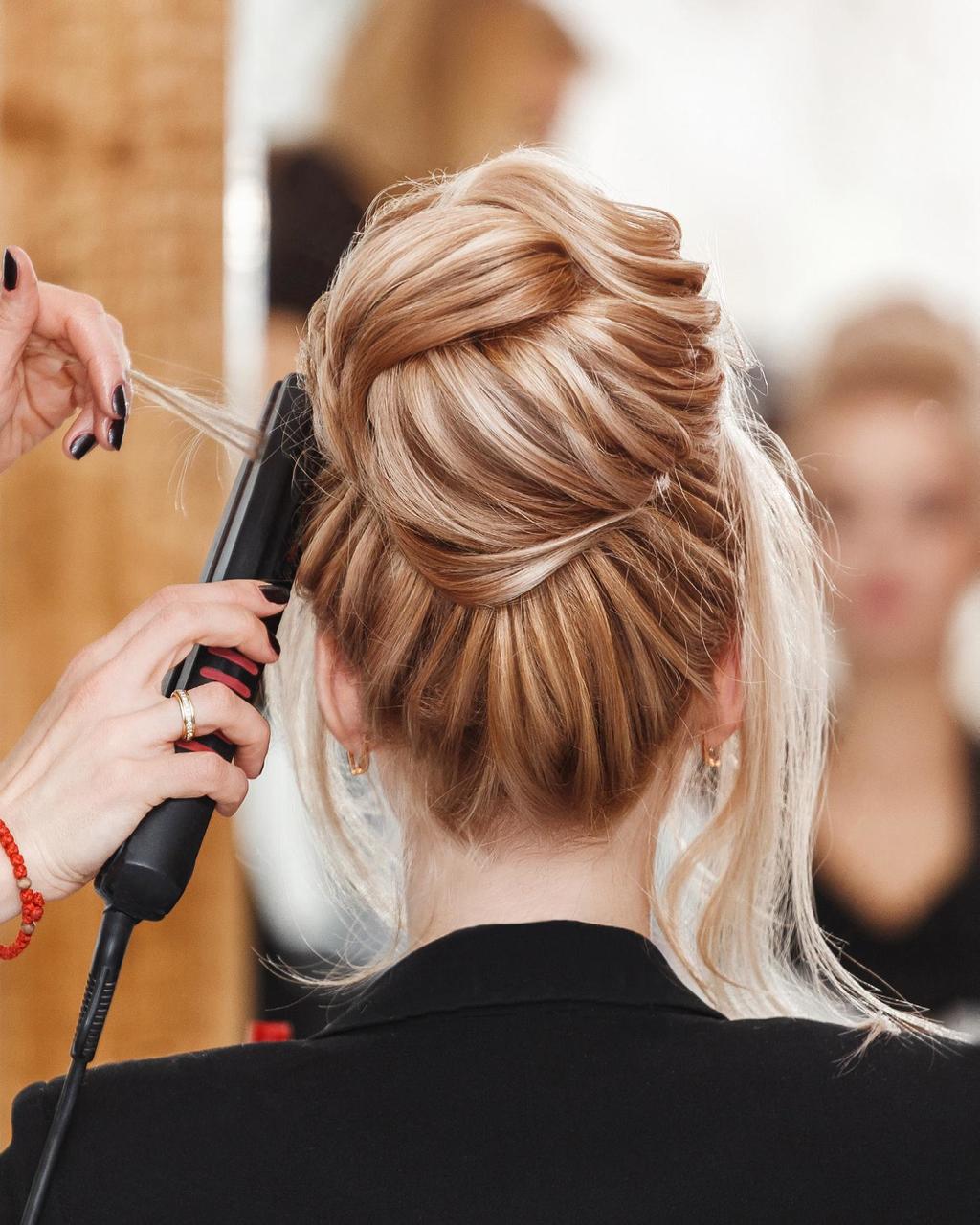 Woman getting her hair styled in an updo at Canyon Ranch Fort Worth Spa Hair Salon