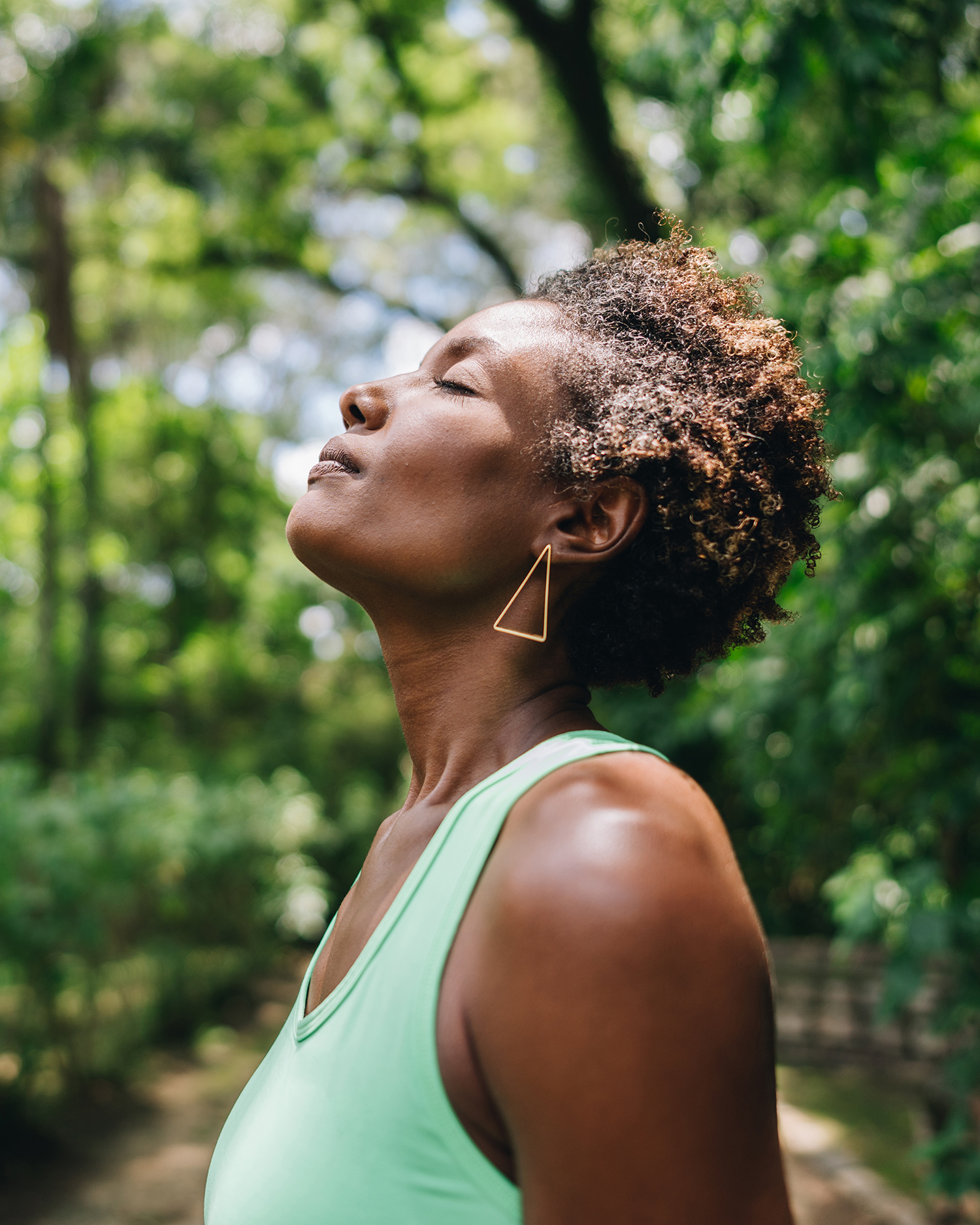 A woman meditating in the forest