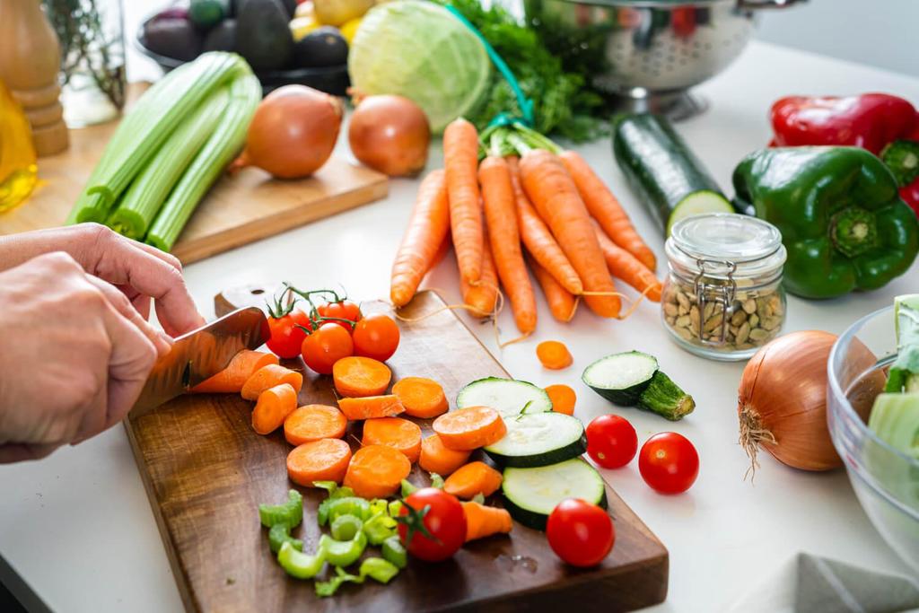 A person chopping vegetables