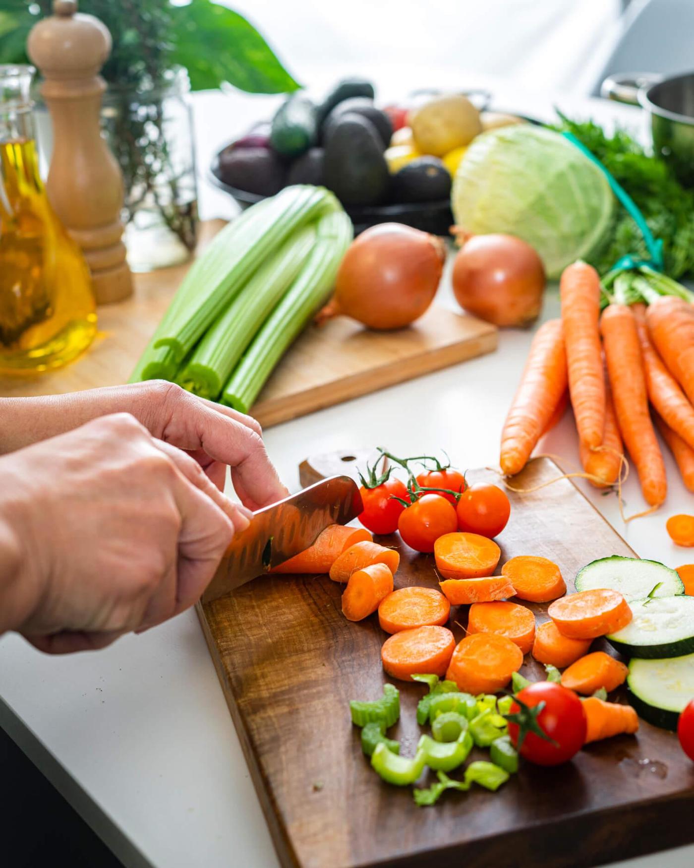 A person chopping vegetables