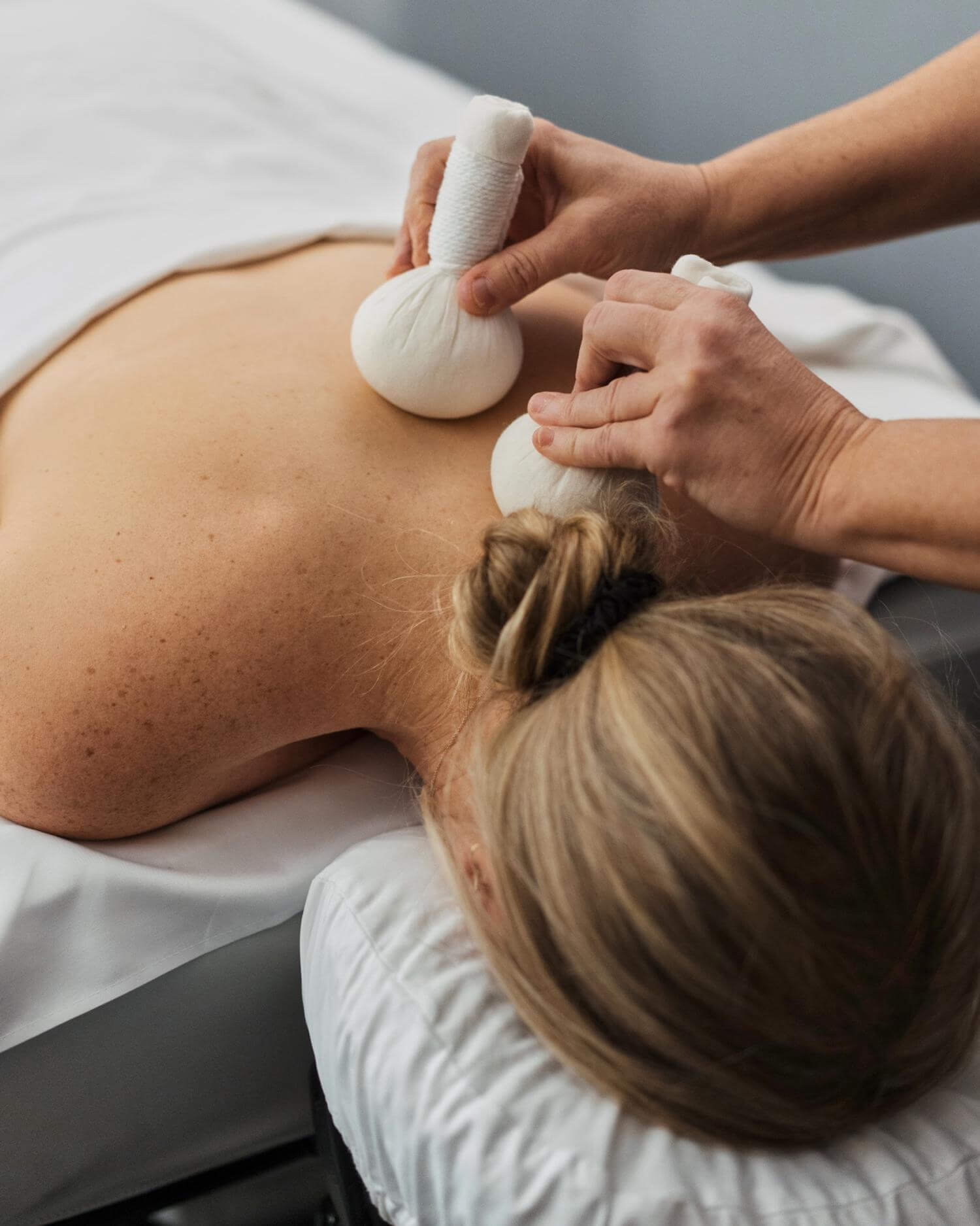 A woman getting a body treatment