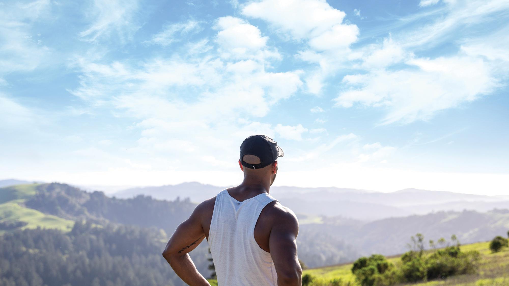 A man looking across a vast landscape