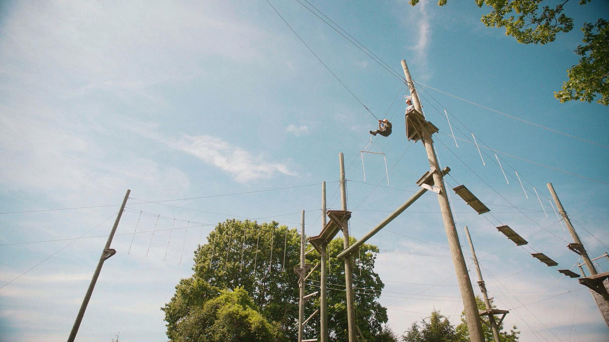 Image of guest enjoying high ropes course