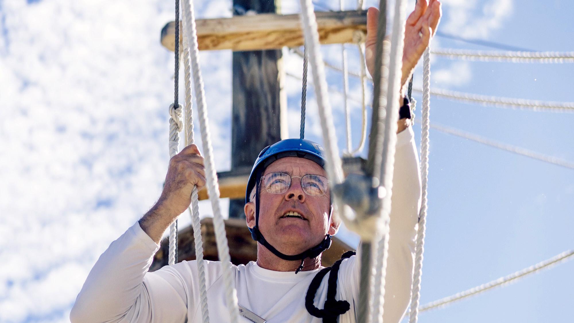 Male guest enjoying the high ropes course