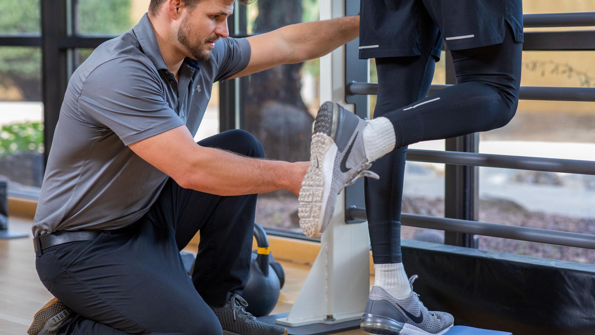 Exercise Physiologist working with a guest.