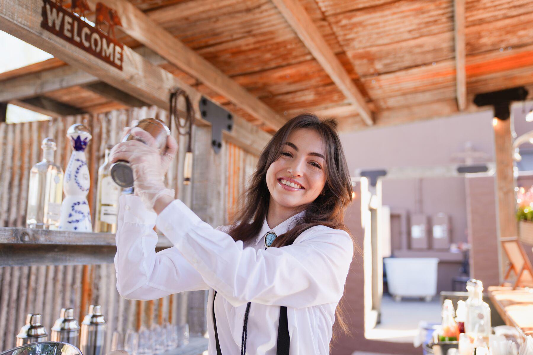 A bartender mixing drinks